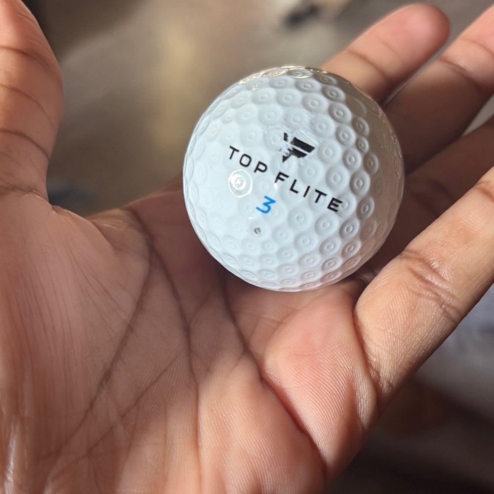 White Golf Ball with Dimpled Pattern